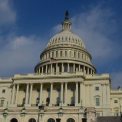 US Flag flying on the Capitol Building in Washington DC.